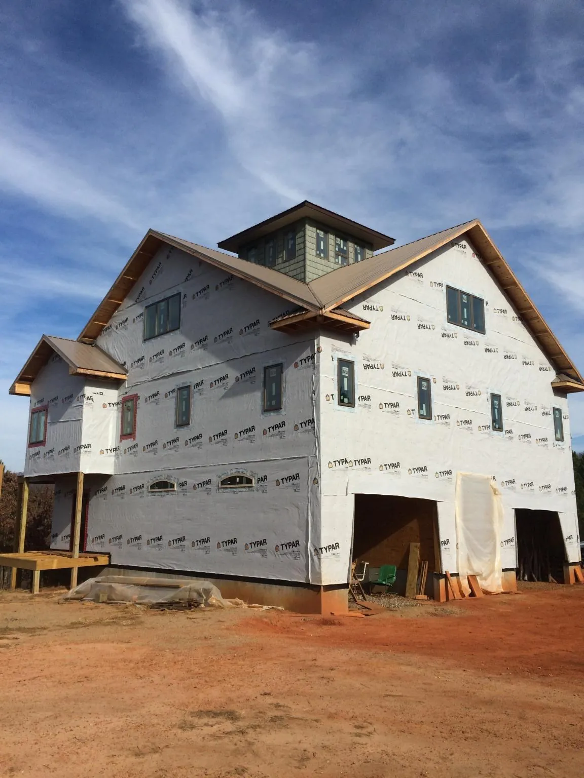 New two story house under construction with a cupola and gabled roofs in Big Clifty